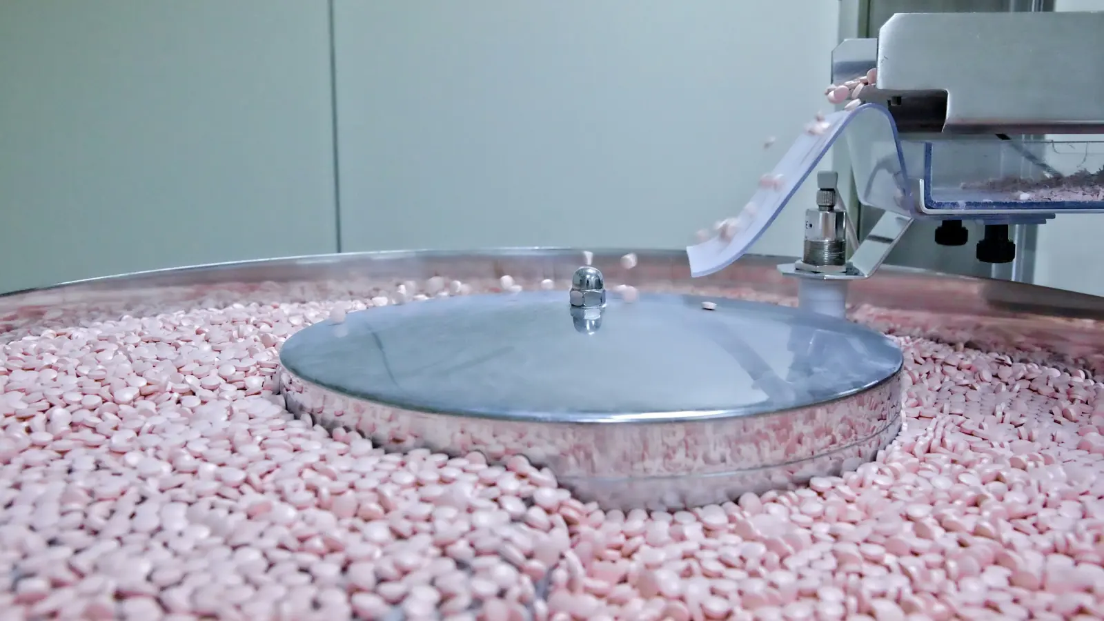 Tablets tumbling in a stainless steel coating pan